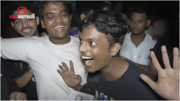 Crowd of fans celebrating at night on a street with one person shouting the viral line, from the Viralbollywood coverage