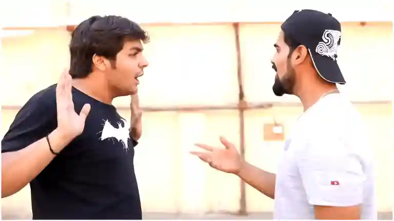 Ashish Chanchlani explaining gully cricket rules with a confident smirk, his hands gesturing as if the matter is already settled