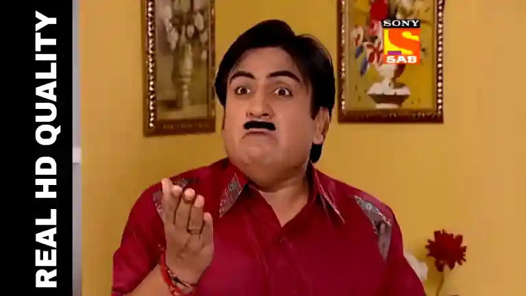 Jethalal glaring with a tense expression in the Gada living room, hand raised mid-argument as Daya Ben stands nearby looking confused