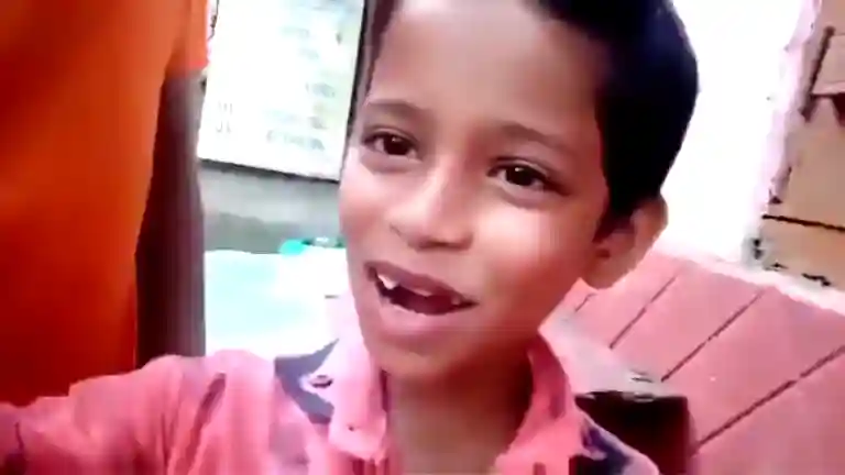 Young Bengali boy looking into camera with a smile as he says true love in Silchar clip